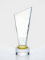 Trophée en verre épuré avec base ronde et anneau doré, idéal comme trophée de bureau.