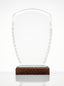 Trophée en verre personnalisable géométrique avec découpes biseautées et insert bleu cobalt.